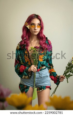 flowers model flower child pink hair retro vintage fashion editorial floral nature hippie hippies chick studio modeling fashion photography studio grey background young woman women teenager 1960s 60s