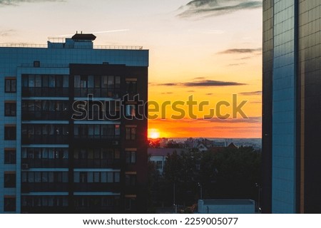 Sunset over the city. City during a warm sunset. 