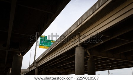 Traffic sign pointing to Nashville on highway 65 as seen from under a bridge in Louisville, Kentucky 