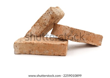 Solid clay bricks used for construction,Old red brick isolated on white background.  Royalty-Free Stock Photo #2259010899