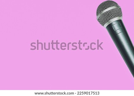 Vocal microphone for singing karaoke isolated on pink magenta                              
