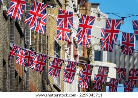 British Union Jack flag garlands in a street in London, UK Royalty-Free Stock Photo #2259045711