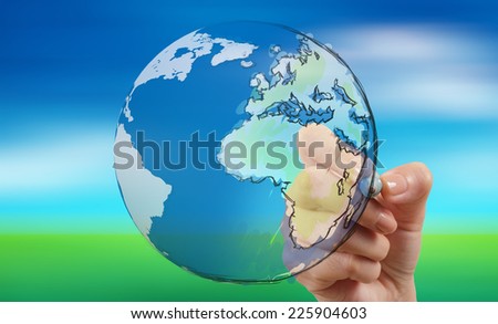female hand drawing earth as concept