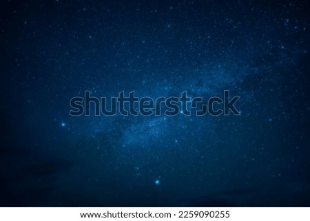 Low angle view of beautiful blue night sky with stars Royalty-Free Stock Photo #2259090255