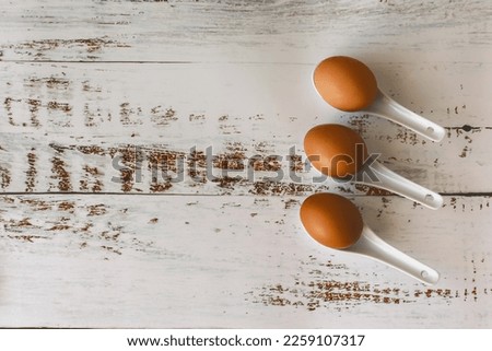 Creative flat lay composition with easter eggs. Natural sun light lighting and sharp shadows. Realistic aesthetic look. Contemporary style.