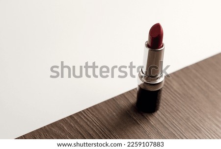 Beautiful photo of red lipstick. The concept of beauty and elegance.