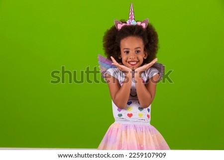 Cute little girl in unicorn costume happy on children's day Royalty-Free Stock Photo #2259107909