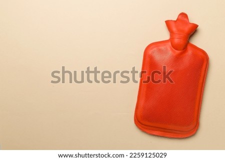Rubber water warmer bag on color background