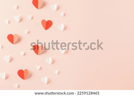 Happy Valentines Day background. Top view flat lay of paper elements cutting white and red hearts shape flying on pink background with copy space, Happy Mother's Day, Banner template design of holiday