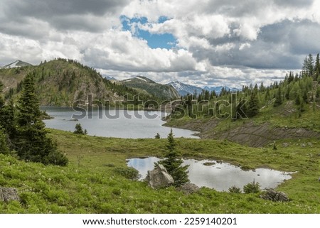 View on Sunshine meadows during summer time with a cloudy and rainy sky, in the Canadian rocky mountains, Banff National Park, Canada