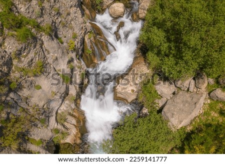 Stream with silky water. Aerial photography with long exposure silky effect. Castril River, Spain.
