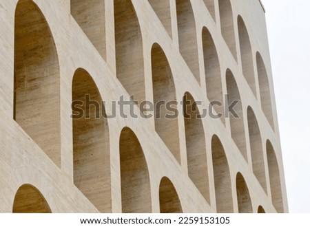 Detail of the arches of the Palazzo della Civiltà Italiana, also known as the Colosseo Quadrato ("Square Colosseum"), is a building in the EUR district in Rome wanted by the fascist regime. Royalty-Free Stock Photo #2259153105