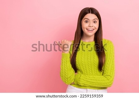 Portrait of charming astonished person toothy smile direct thumb finger empty space isolated on pink color background