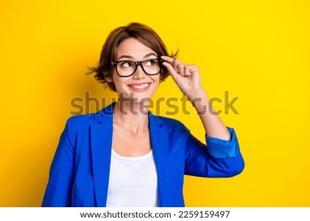 Photo of dreaming cute minded businesswoman touch eyewear specs smiling wear trendy vision glasses look mockup isolated on yellow color background Royalty-Free Stock Photo #2259159497