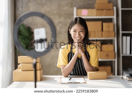 Young business woman working at home. startup sme small business entrepreneur SME distribution warehouse with parcel mail box. SME Online marketing and product packaging and delivery service.