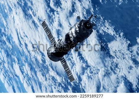 Space cargo ship in flight. Elements of this image furnished by NASA. High quality photo