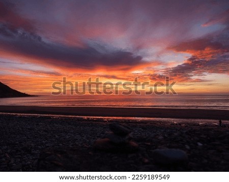 Sunset view of a beach in Fairbourne