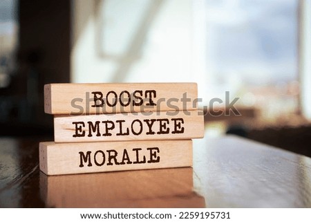 Wooden blocks with words 'BOOST EMPLOYEE MORALE'. Business concept Royalty-Free Stock Photo #2259195731