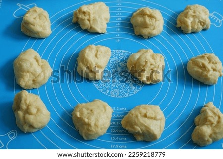 selective focus of divided dough bread on the blue silpat 