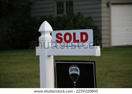 A sold sign outside the house