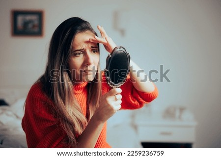 
Woman Checking Forehead Expression Wrinkles Feeling Concerned. Stressed millennial girl feeling self-conscious about aging signs on her skin
 Royalty-Free Stock Photo #2259236759