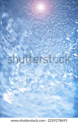 Blue water texture. Bubbles bubbling water.