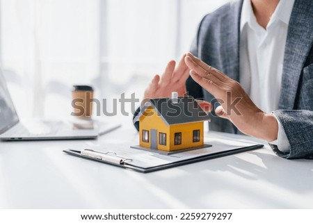 Lawsuits against Real estate agent and realtor general liability insurance businessman professional discussing and consultant with house toy model building, protect your house and building Royalty-Free Stock Photo #2259279297