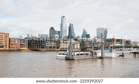 Modern skyline on Thames river with pierre  - London, United Kingdom