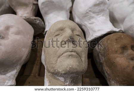Modern art detail, realistic sculpted faces