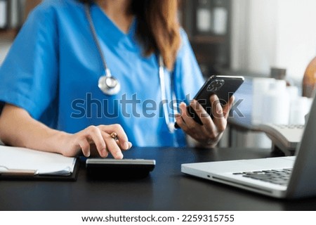 Medical technology concept. Doctor working with mobile phone and stethoscope at hospital

