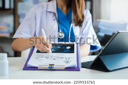 Medicine doctor hand working with modern digital tablet computer interface as medical network concept at hospital