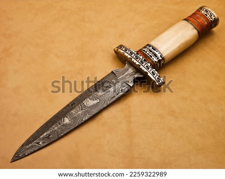 Handmade Beautiful Damascus Dagger Knife An Eye Catching Knife  Royalty-Free Stock Photo #2259322989