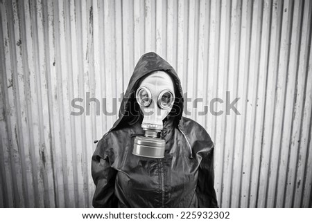 Woman with hooded gas mask, fear