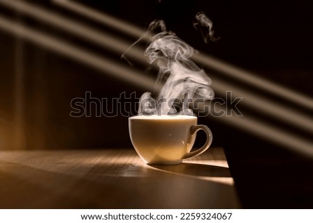 Hot Coffee Mug With Smoke With Natural Lighting And Shadow In Morning Time, Coffee Time Royalty-Free Stock Photo #2259324067