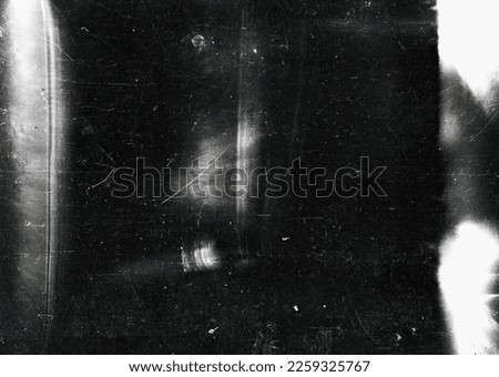 Dusty scratched and scanned old film texture Royalty-Free Stock Photo #2259325767