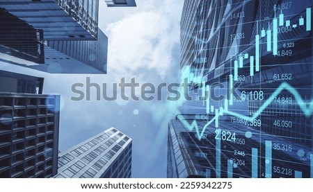 Real estate, development and investing concept with financial chart indicators and stock market graphs on city skyscrapers tops bottom view, double exposure