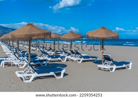 Sunbeds and umbrellas at Playa de Venus at Marbella, Spain
