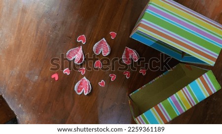 surprise gift box in wooden background for romantic valentine day