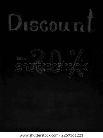 Black Board in black chalk background with inscription minus twenty percent - 20 %. dark chalkboard. 