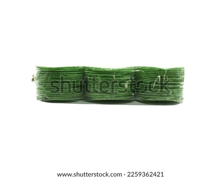 Simping cake is a typical snack of Purwakarta, West Java, made from tapioca flour, wheat plus flavoring seasonings and various flavors of spices and fruits. This simping is pandan leaves flavor. Royalty-Free Stock Photo #2259362421