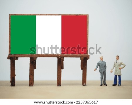 Mini toy at table with white background. Italy flag design.