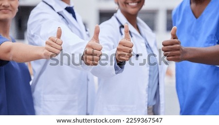 Doctor, thumbs up and medical teamwork with hands, smile or support for healthcare, wellness and mockup. Group, doctors and diversity with yes sign, team building or vision with solidarity for health