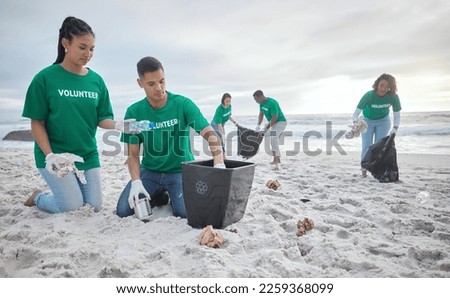 Collaboration, charity and recycling with people on beach for sustainability, environment and eco friendly. Climate change, earth day and nature with volunteer and box for help, energy and pollution Royalty-Free Stock Photo #2259368099