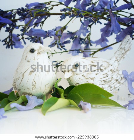 Bird with spring blossom branch