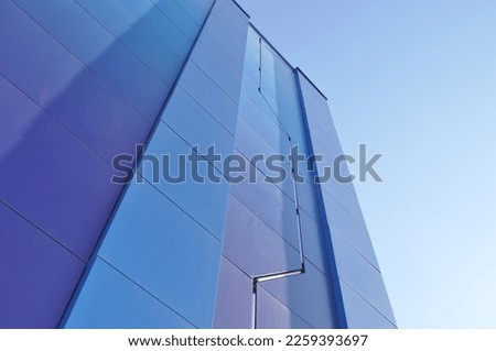 Minimalistic picture. A blue building against a blue sky.