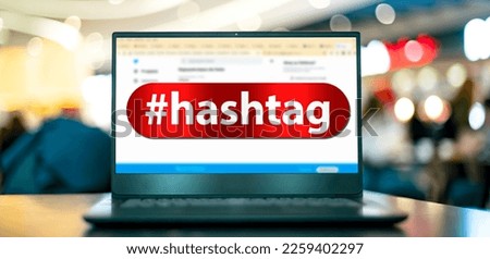 Laptop computer displaying the sign of hashtag on the Internet
