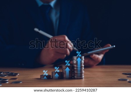 Fund trading concept. Businessman planning long-term investments, buying DCA mutual funds, analyzing economic trends, stock market volatility, taking high investment risks. Fund management, coins. Royalty-Free Stock Photo #2259410287