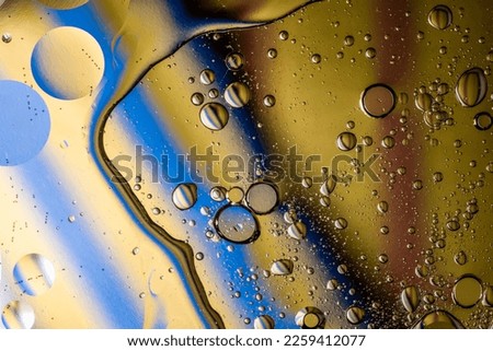 Oil stains and stains on the water surface. Royalty-Free Stock Photo #2259412077