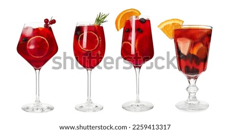 Set with glasses of Red Sangria cocktail on white background Royalty-Free Stock Photo #2259413317