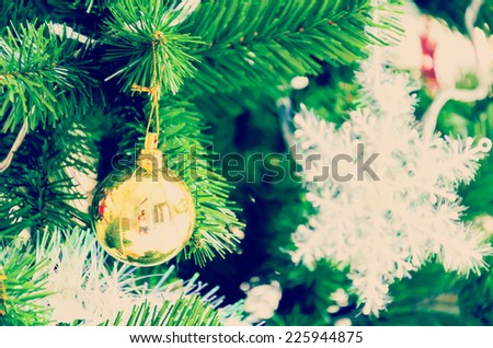 Decorate Christmas tree using as background process vintage instagram effect style picture